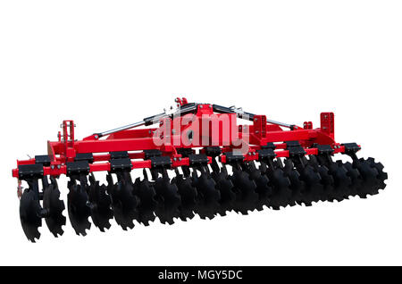Disc harrow trailer for a farming tractor. Metal discs to break ground. Isolated on white. Stock Photo