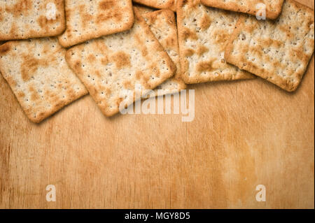 Crackers on wooden background. Stock Photo