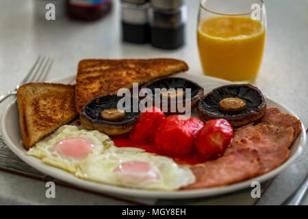 Cooked English breakfast in a white kitchen Stock Photo
