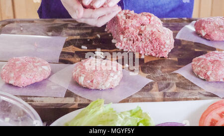 Preparing gourmet burger patties with ground beef. Stock Photo