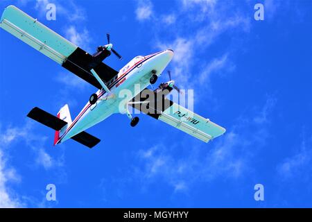 MAHO, ST MAARTEN - FEBRUARY 27TH 2018: A Winair plane coming in to land at Princess Juliana International Airport. Shot was taken from the beach below Stock Photo