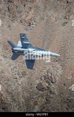 Close Up Image Of A US Navy F/A-18F Super Hornet Jet Fighter, Flying At Low Level Through Rainbow Canyon, California, USA. Stock Photo