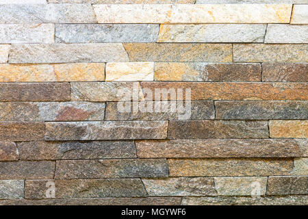 Decorative stone for decoration of the fireplace. Background. Stock Photo