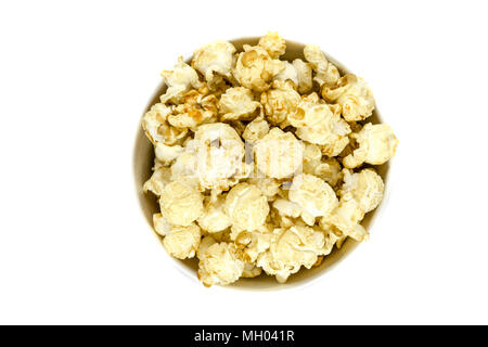 Top view of caramel popcorn in cup on white background Stock Photo