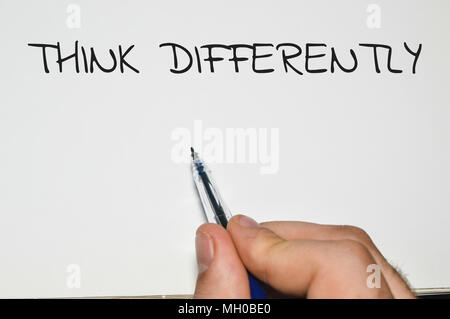 Think differently word written on white paper Stock Photo