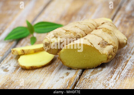 Fresh ginger on rustic wooden surface Stock Photo
