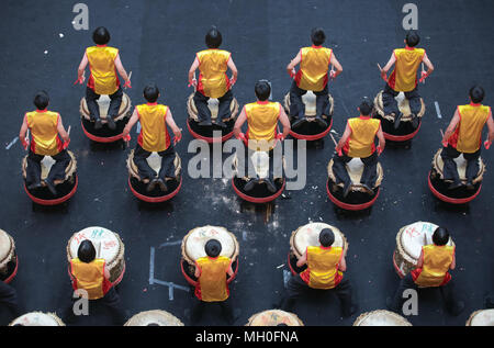 Teenagers performing chinese lion dance drum rhythmic show and dance at VIVA HOME shopping mall in Kuala Lumpur, Malaysia. Stock Photo