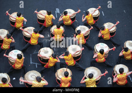 Teenagers performing chinese lion dance drum rhythmic show and dance at VIVA HOME shopping mall in Kuala Lumpur, Malaysia. Stock Photo