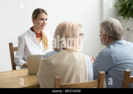 Senior couple asking advice about investment meeting with financ Stock Photo