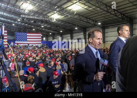Washington Township, Michigan USA - A Fox News reporter broadcasts live during President Donald Trump's campaign rally in Macomb County, Michigan, whi Stock Photo