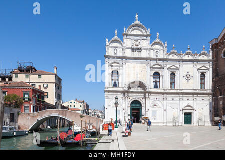 Scuola Grende di San Marco, Campo Santi Giovanni e Paolo, Castello, Venice, Veneto, Italy with gondolas in front of Ponte Cavallo. Now a civic hospita Stock Photo