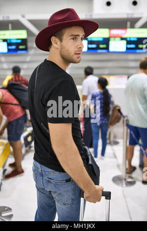 Young guy in airport Stock Photo