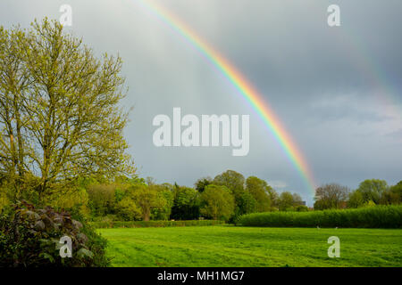 Rainbow over fields and countryside in Grantchester, Cambridge, Cambridgeshire, UK Stock Photo