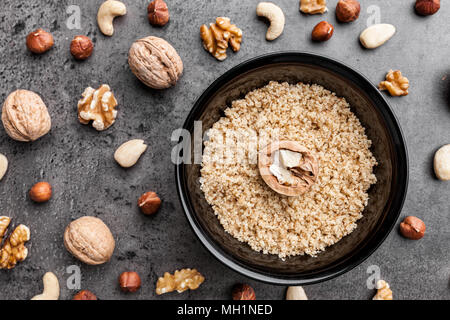 Delicious walnuts on grey rustic background Stock Photo