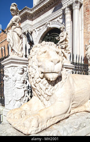 Marble lion in front of entrance to the Venetian Arsenal, Venice, Italy Stock Photo