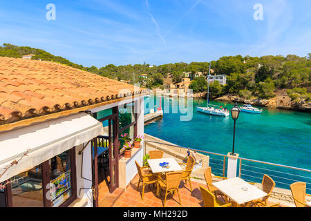 CALA FIGUERA BAY, MAJORCA ISLAND - APR 16, 2013: Tables on terrace of coastal restaurant located in beautiful village. Balearic islands are most visit Stock Photo