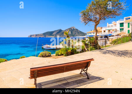 View of sea from bench on coastal promenade in Sant Elm town, Majorca island, Spain Stock Photo