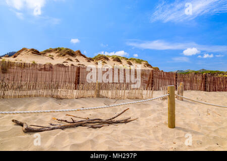 Sand dune and wind fence on Cala Mesquida beach, Majorca island, Spain Stock Photo