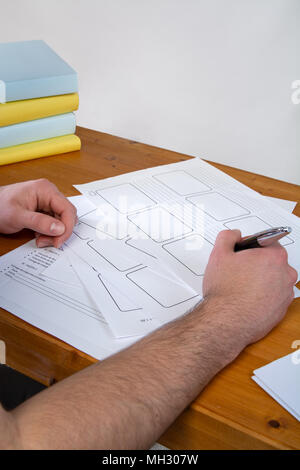 a young man writing, making an argument for a video Stock Photo