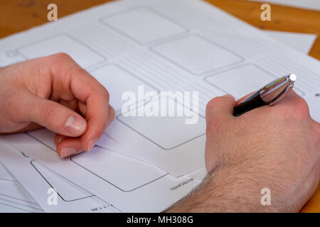 a young man writing, making an argument for a video Stock Photo