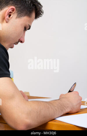 a young man writing, making an argument for a video Stock Photo