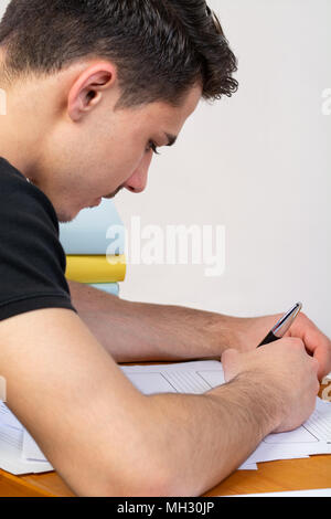 a young man writing, making an argument for a video Stock Photo