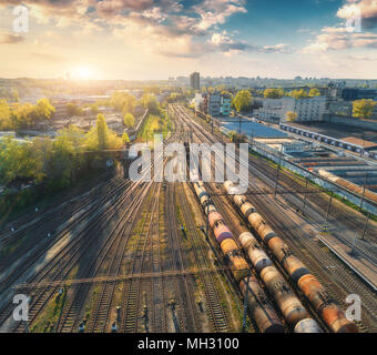 Aerial view of colorful freight trains on railway station. Wagons with goods on railroad. Cargo trains. Heavy industry. Industrial scene with trains,  Stock Photo