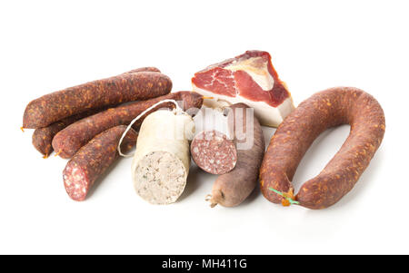 Assortment of german sausage specialties hard cured salami, liver sausage (Leberwurst), blood sausage (Blutwurst) and bacon over white background Stock Photo