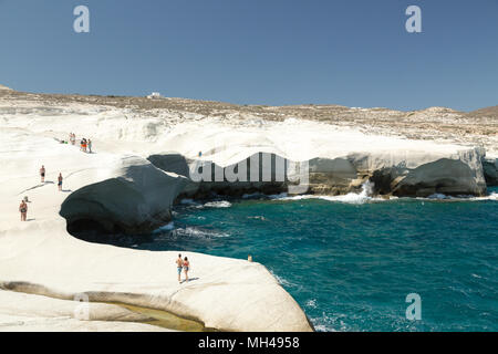 tourists at Sarakiniko beach on Milos island, Greece Stock Photo