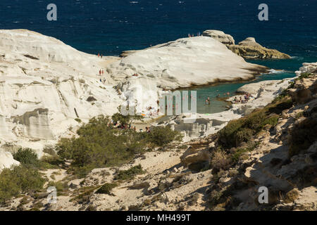 tourists at Sarakiniko beach on Milos island, Greece Stock Photo