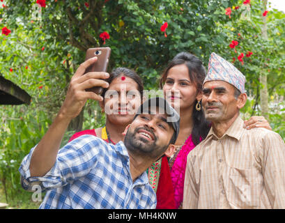 Gorkha,Nepal - Sep 30,2017: Happy Asian Family taking a Selfie in the rural village of Nepal. Stock Photo