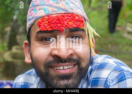 Gorkha,Nepal - Sep 30,2017: Portrait of a happy nepali man at dashain festival in Nepal. Stock Photo