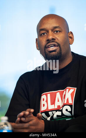 4-21-2018, SPRINT Pavilion, Charlottesville, VA, USA. President of Black lives Matter of Greater New York, Hawk Newsome, speaking during Listen First in Charlottesville.  Listen First was part of the first National Week of Conversation (April 20-28, 2018).  Listen First’s weekend events in Charlottesville, VA, were created to support healing and reconciliation after 2017 white supremacist and pro-confederacy protests left one woman dead and a community divided.  A small number of seats of the 3,500 seat amphitheater were occupied on Saturday as speakers and panel discussions were presented. Stock Photo