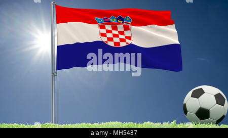 Flag of Croatia fluttering and a football rolls on the lawn, 3d rendering Stock Photo