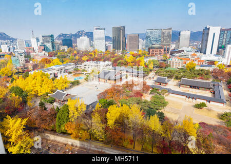 View of Seoul city and autumn in Deoksugung palace Stock Photo