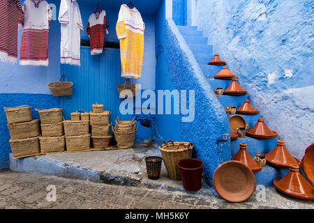 Handmade souvenirs in colorful small street of Chefchaouen, the Blue city, in Morocco Stock Photo