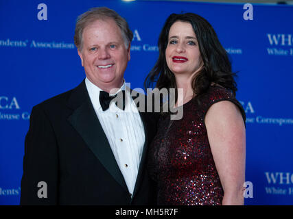 Washington, USA. 28th Apr, 2018. United States Senator Doug Jones (Democrat of Alabama) and his wife, Louise New, arrive for the 2018 White House Correspondents Association Annual Dinner at the Washington Hilton Hotel on Saturday, April 28, 2018. Credit: Ron Sachs/CNP (RESTRICTION: NO New York or New Jersey Newspapers or newspapers within a 75 mile radius of New York City) - NO WIRE SERVICE - Credit: Ron Sachs/Consolidated/dpa/Alamy Live News Stock Photo