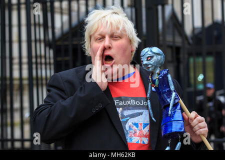 Westminster, London, 30th April 2018. 'Faux BoJo', a.k.a. Drew Galdron, performs as Foreign Secretary Boris Johnson opposite 10 Downing Street, singing with a puppet of Theresa May. Anti-Brexit and pro-European protesters gather outside and opposite 10 Downing Street for the 'Vigil against Brexit', while the House of Lords again debates the European Union (Withdrawal) Bill.