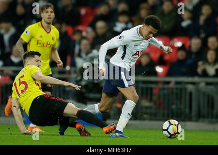 London, Britain. 30th Apr, 2018. Tottenham Hotspur's Dele Alli (R) vies with Watford's Craig Cathcart during the Premier League soccer match between Tottenham Hotspur and Watford at Wembley Stadium in London, Britain, on April 30, 2018. Tottenham Hotspur won 2-0. Credit: Tim Ireland/Xinhua/Alamy Live News Stock Photo
