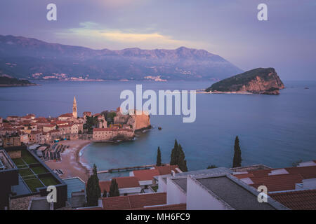 Sunset over the popular summer resort town Budva on the Adriatic coast in Montenegro Stock Photo