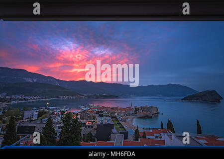 Sunset over the popular summer resort town Budva on the Adriatic coast in Montenegro Stock Photo