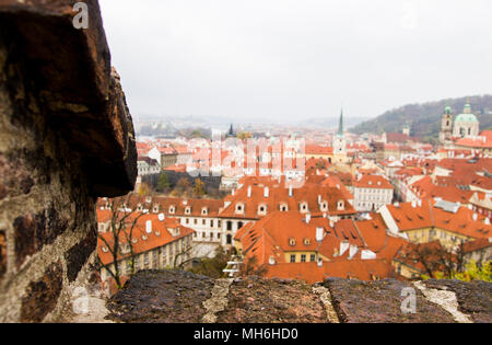 Panoramic view of city center with tiled red roofs from the top, Prague, Czech Republic. Panoramic view of Old town of Prague with tiled roofs. Red roofs. Europe. Stock Photo