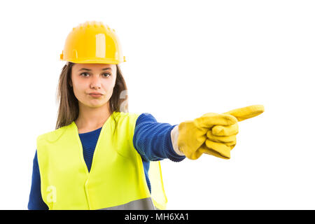 Young female architect or engineer showing denial gesture as refusal of construction project concept isolated on white background Stock Photo