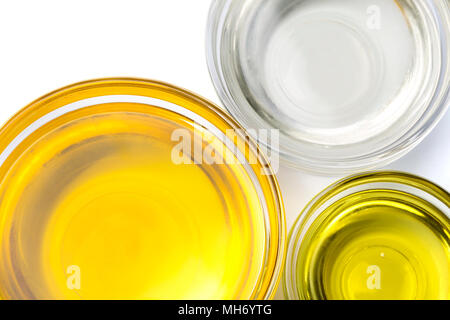 Various types of oil in jars isolated on white background Stock Photo