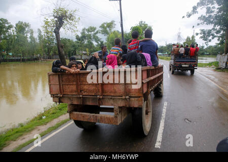 Rohingya refugees, who arrived from Myanmar, on their way to a refugee camp at Teknaf in Cox's Bazar, Bangladesh. Stock Photo