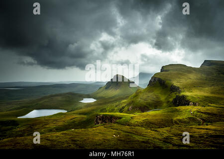 Scenic view of beautiful landscape the Quiraing, Isle of Skye, Scotland from above with view into the valley and hills in the background and dramatic Stock Photo