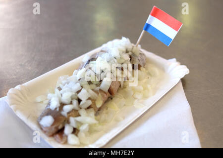 Traditional dutch food: herring fish with onion in fastfood market of Amsterdam, Netherlands Stock Photo