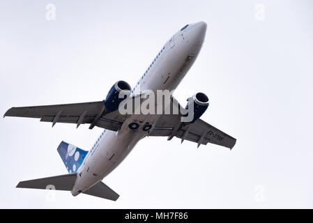 Novosibirsk, Russia - April 27, 2018: Boeing 737-3K2  EX-37015 Avia Traffic Company   after takeoff from Tolmachevo International Airport. Stock Photo