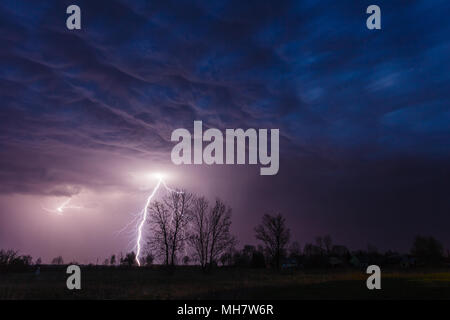 Lightning strike under dramatic sky Stock Photo