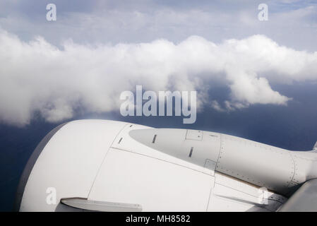 View from plane window on engine and clouds. Stock Photo